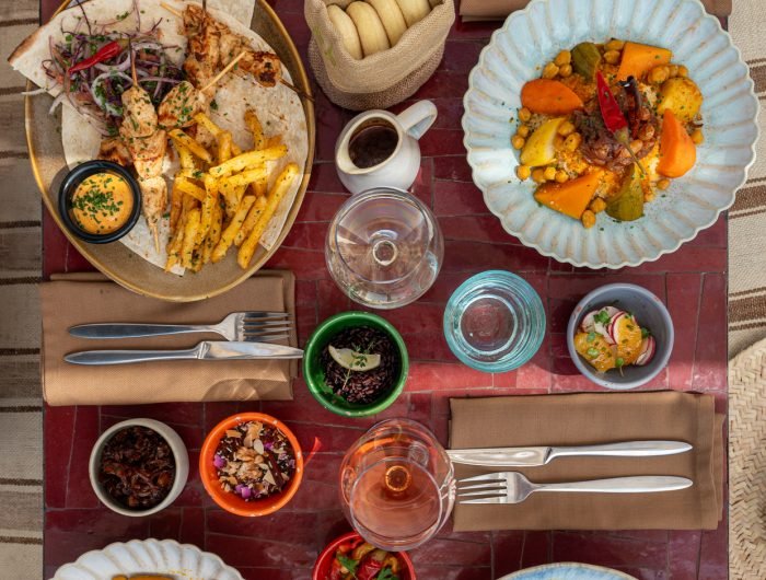 Rooftop lunch restaurant in Marrakech Medina with panoramic views of Koutoubia Mosque and Atlas Mountains at Dardar