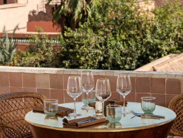 Panoramic view from Dardar Rooftop restaurant in Marrakech Medina at sunset with Atlas Mountains in the background